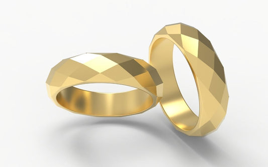 Faceted solid gold ring